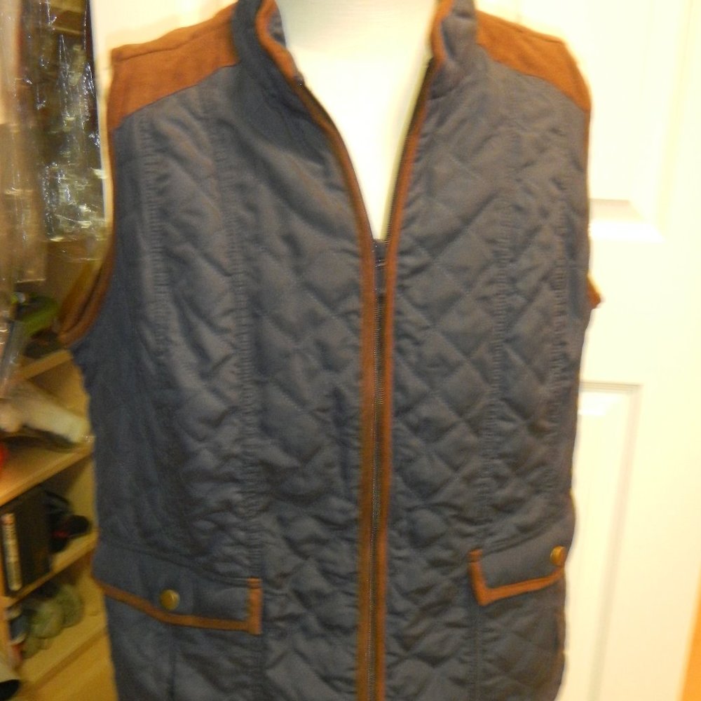 Blue quilted,  zip front vest with brown trim